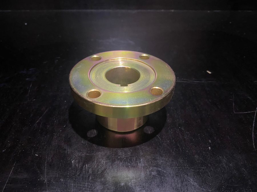 1310 Flange Coupling with ¼″ keyway, zinc-coated, for 1 ¼″ input shaft, showing bolt-hole pattern.
