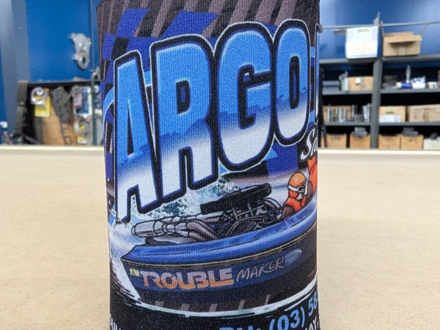 Argomarine stubby holder with Argo Marine Shepparton branding standing on a bench in the workshop.